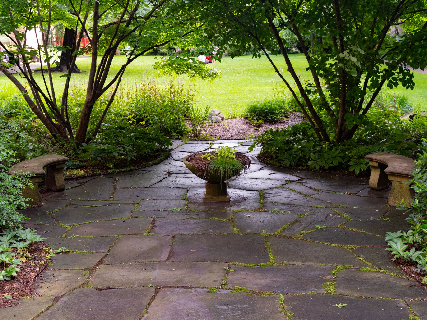 Stone garden patio with planted borders, a stock design reference